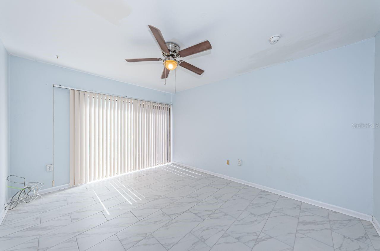 Primary bedroom opens to water views.