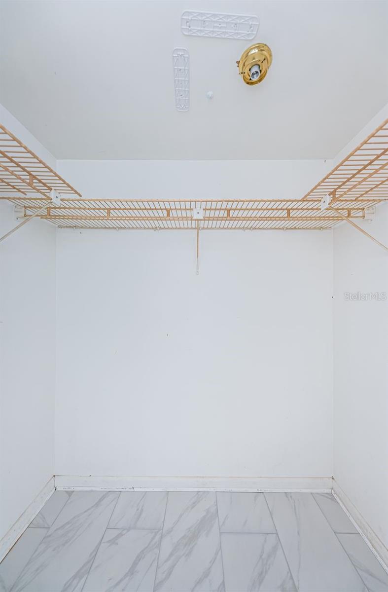 Primary walk-in closet.