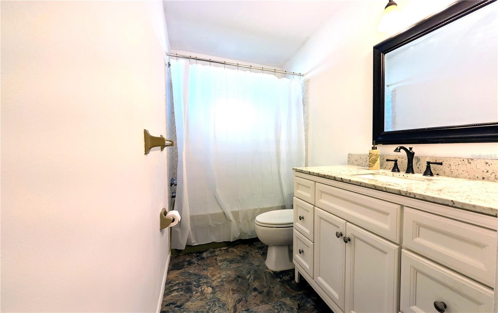 Large, updated vanity for all your bathroom storage.