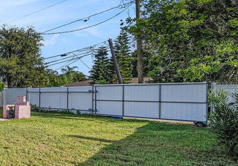 Full size sliding gate for access to backyard from alley.