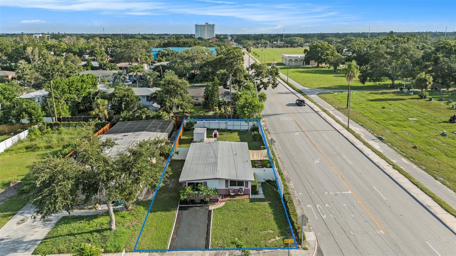 Shows the spacious yard around the home. This arial view is looking north.