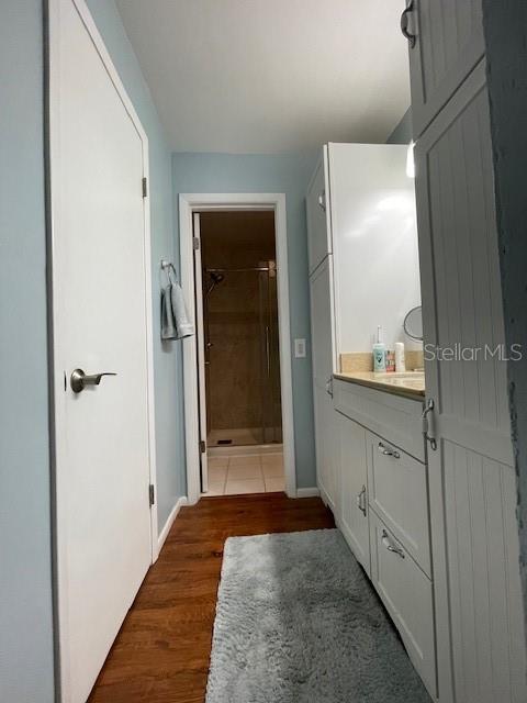 Main Bathroom at the end; Vanity on the right & Walk-in closet on the left