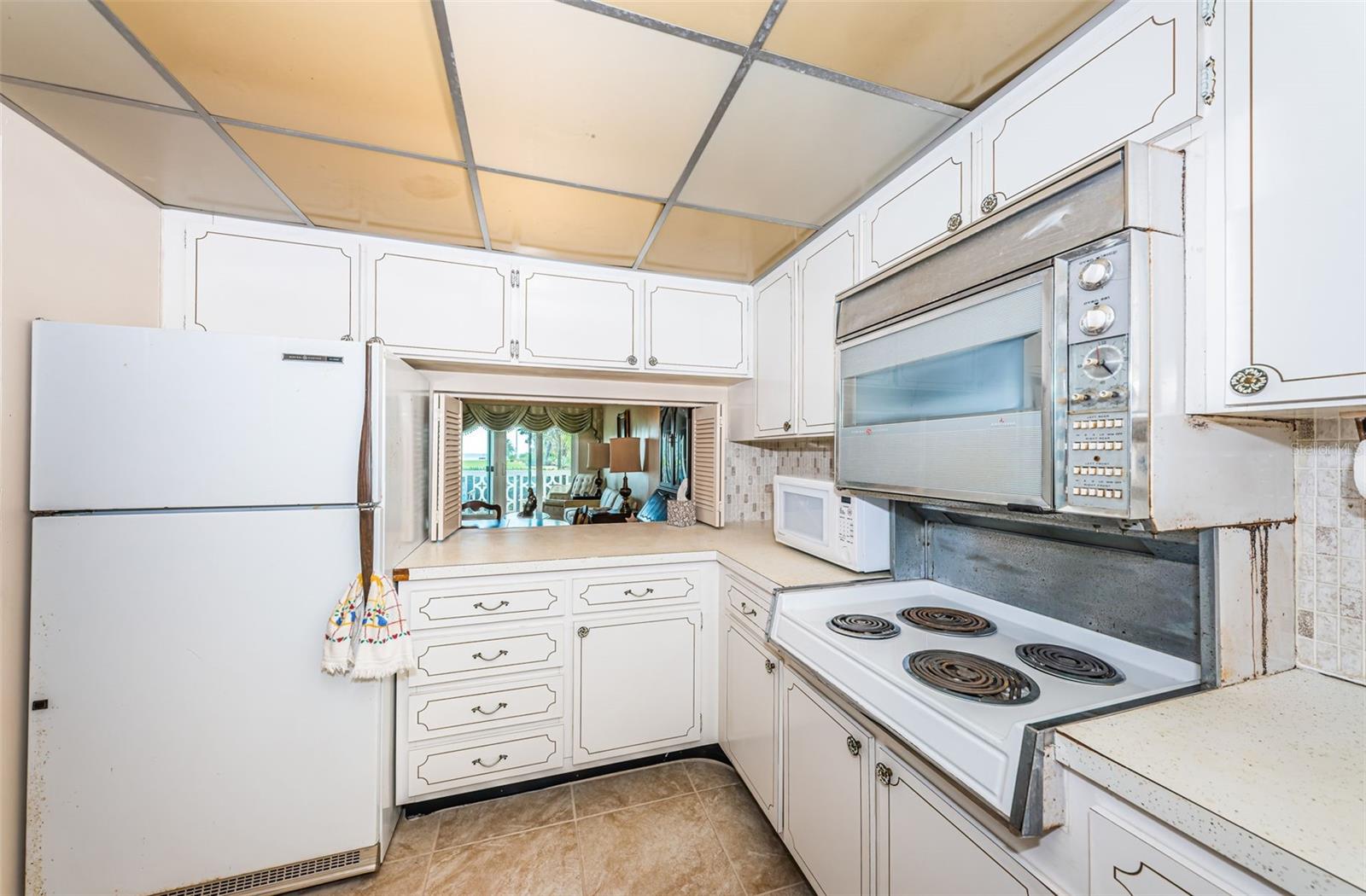 Kitchen has pass-through to dining and living room.