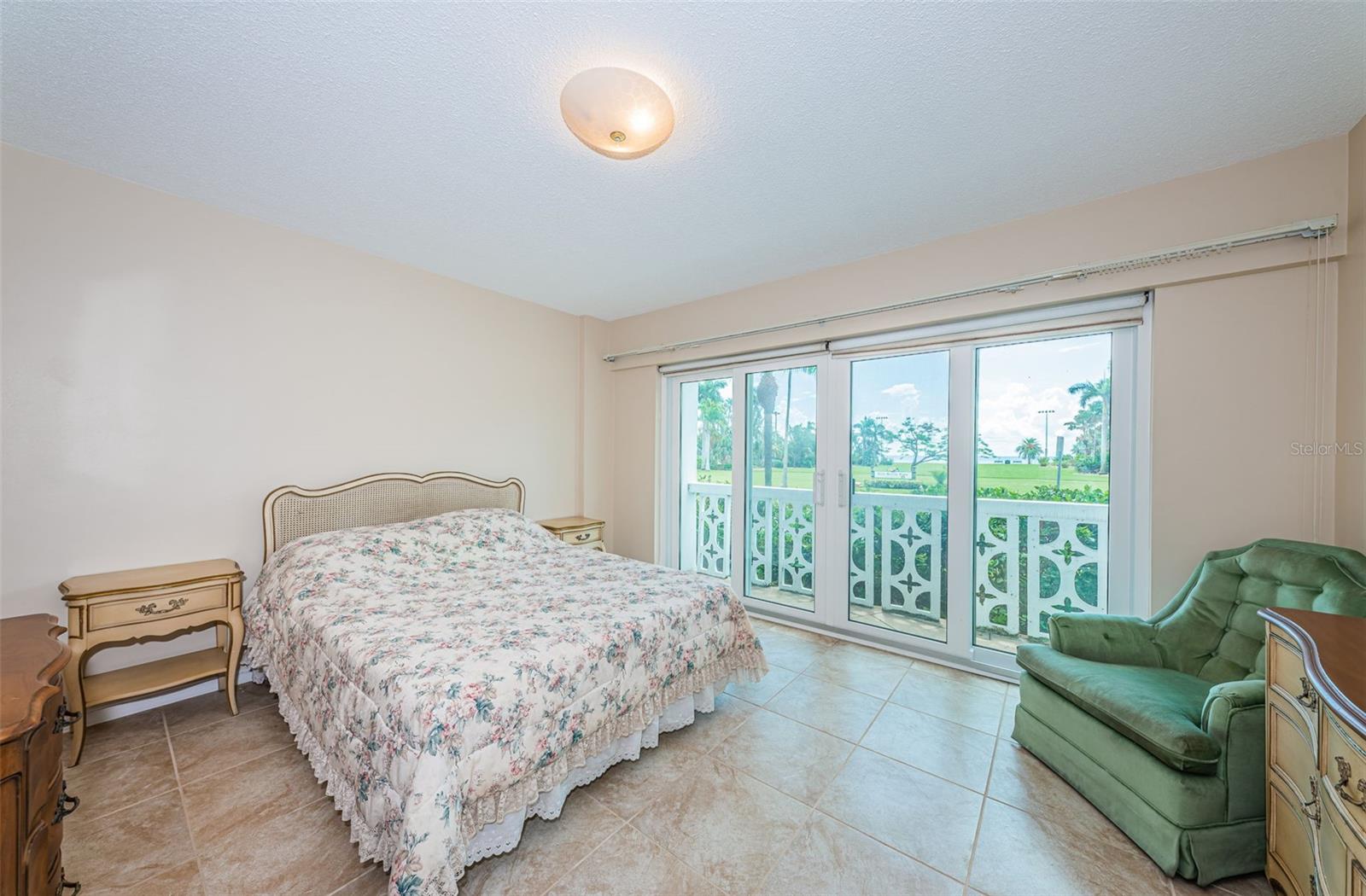 Master bedroom has impact windows and sliding doors to another patio