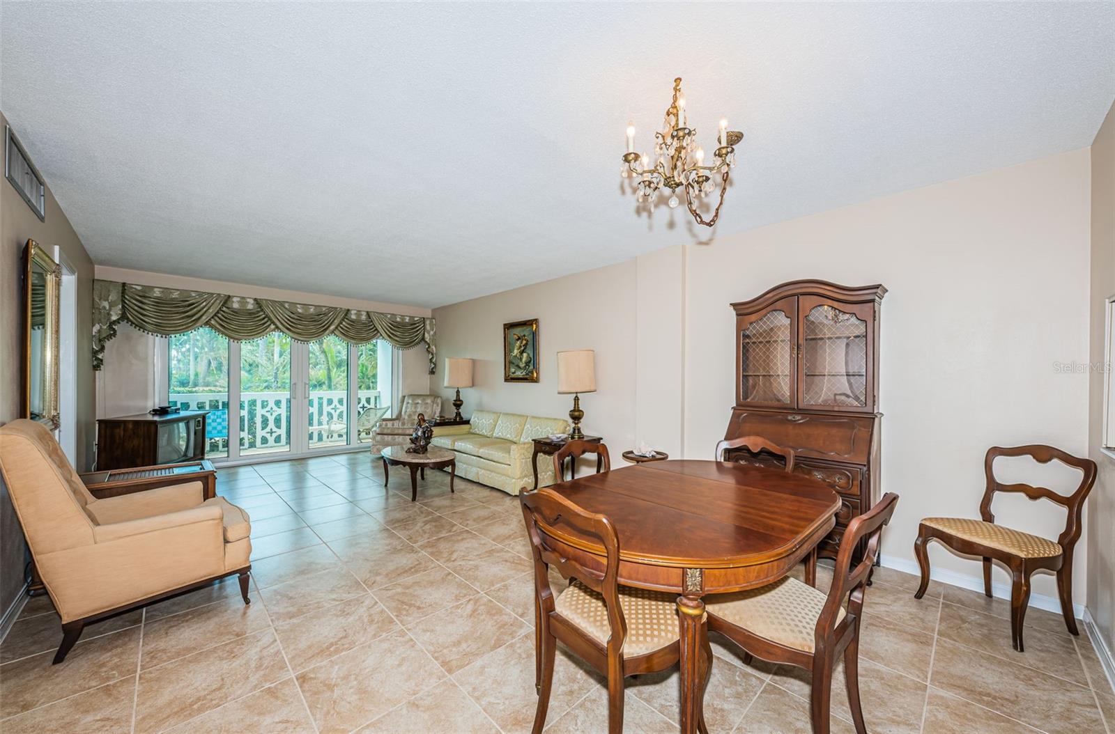 Dining and living rooms with newer tile floors