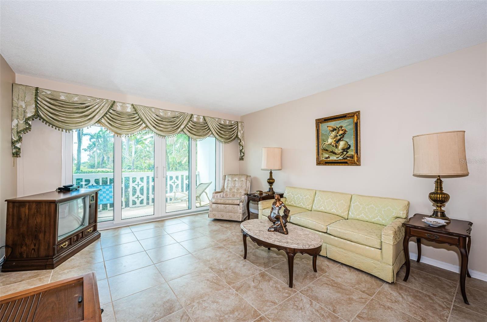 Spacious living room has impact sliding doors and windows
