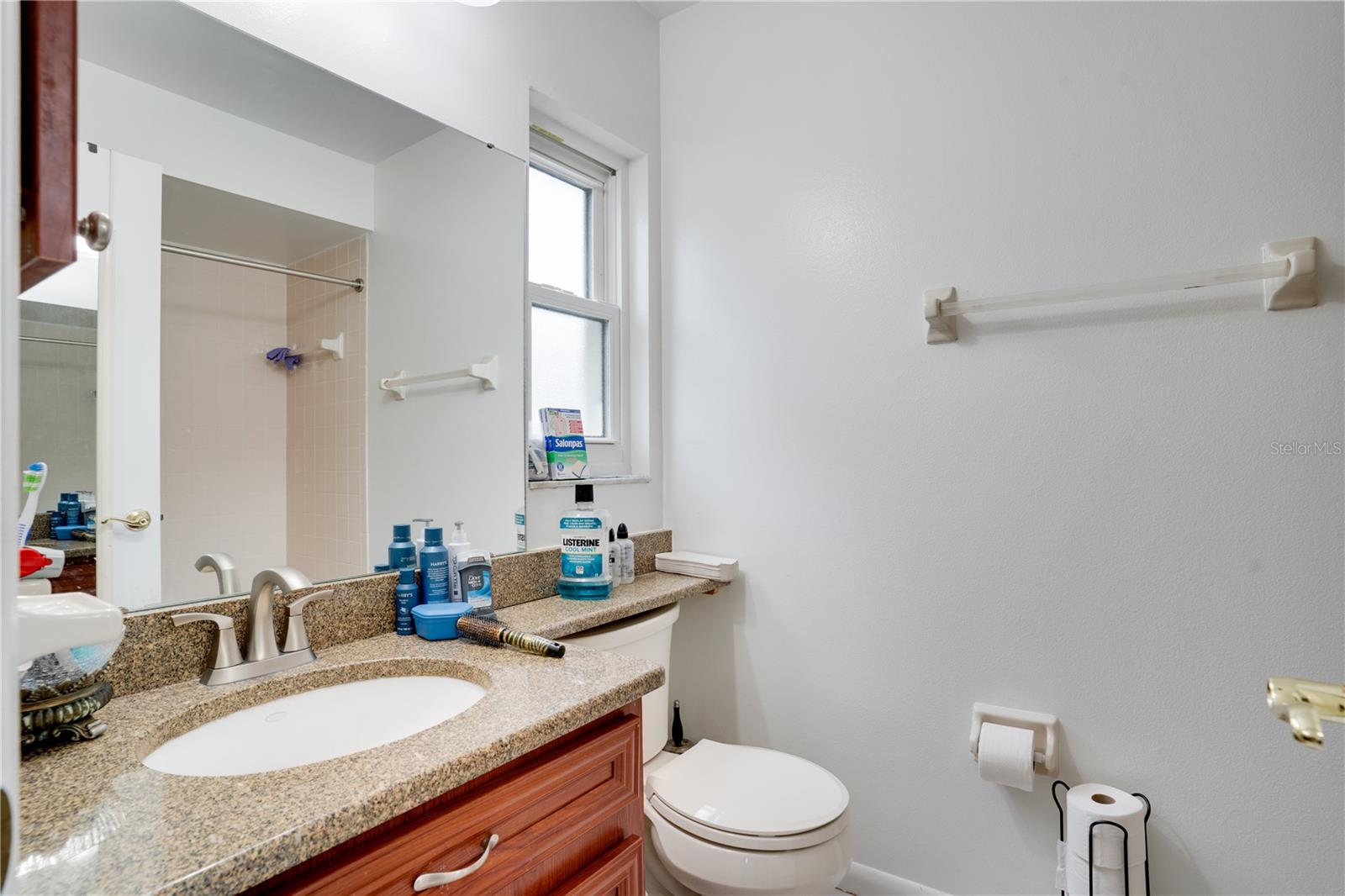 Primary bath with second vanity. Lighting updated 2025