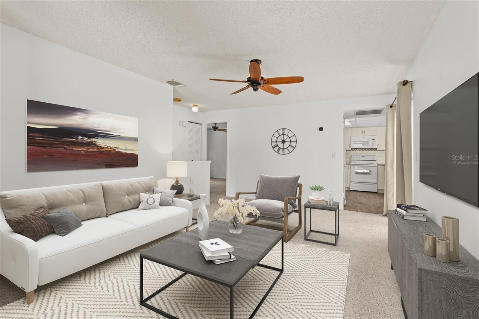 Virtually staged- view of living and kitchen from front door