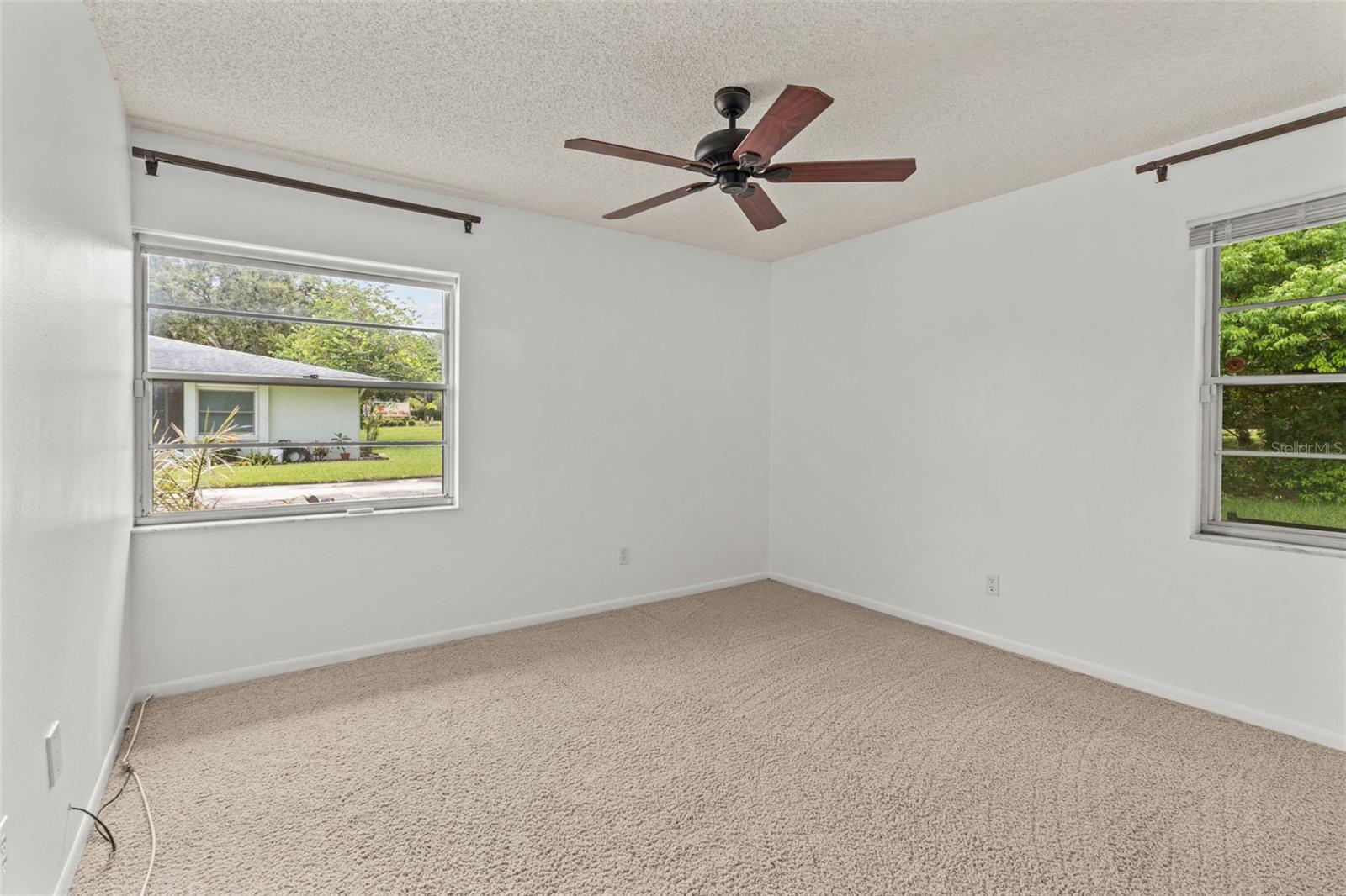 2nd bedroom with view of the front of the home