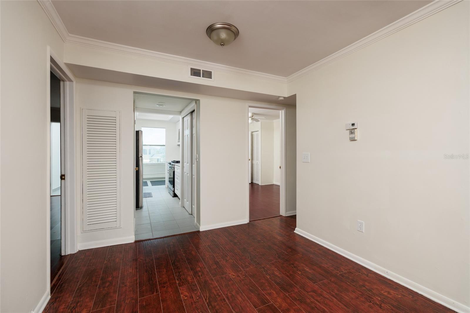 Dining Area w/Crown Molding. 9'x 8'. Kitchen in middle & bedrooms on both sides. Bathroom on right side of dining area.