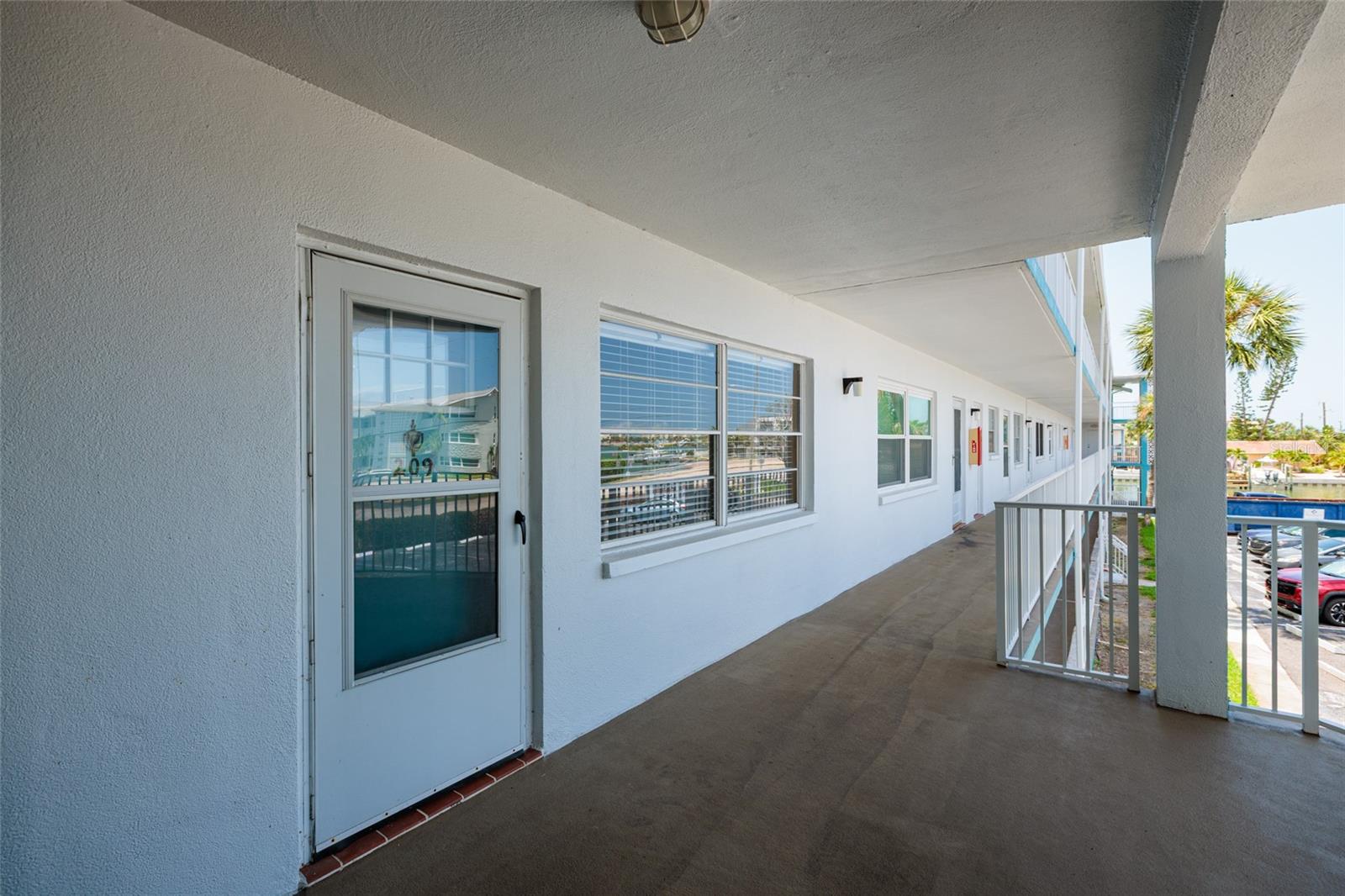 Unit 209 on 2nd floor w/Screened storm door. Laundry room on this floor too (they're on every floor).