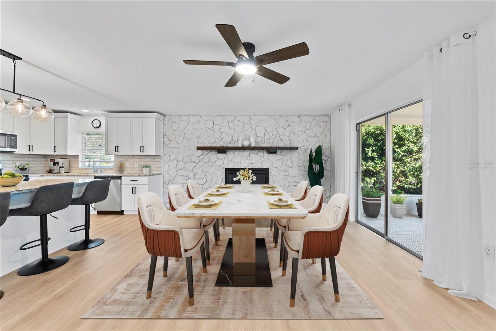 virtually staged, looking from living room into dining room and kitchen