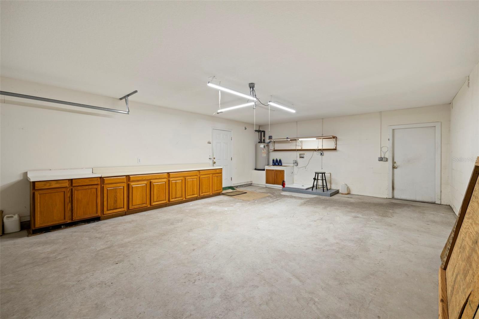 LARGE GARAGE WITH STORAGE CABINETS