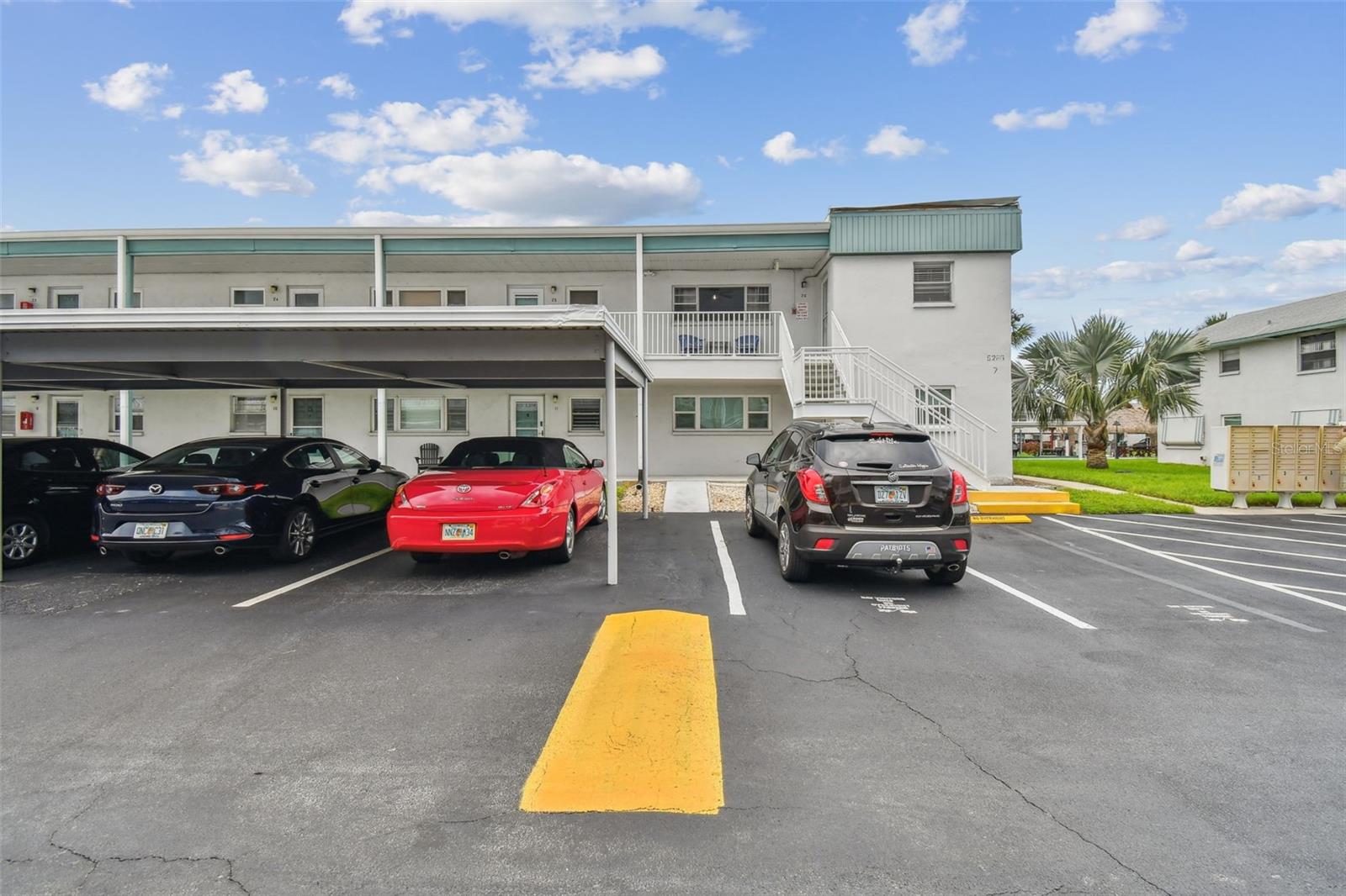 Carport space - red car
