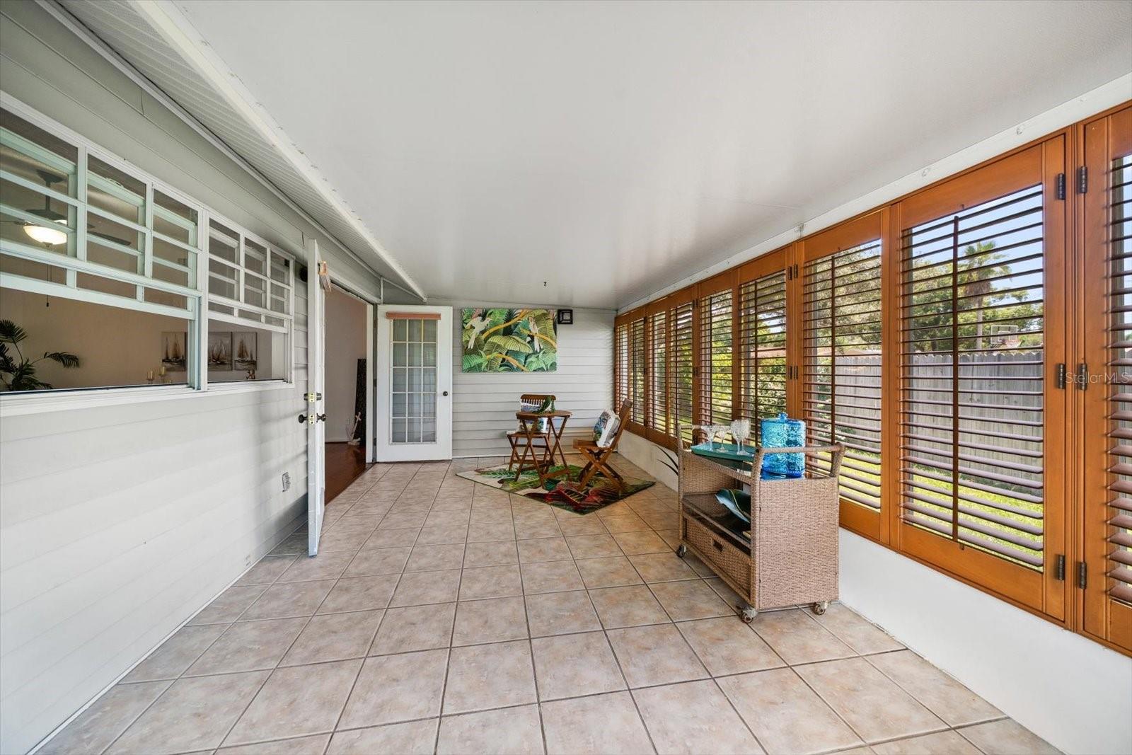 Sun room entrace to back yard where you can create an outdoor oasis.