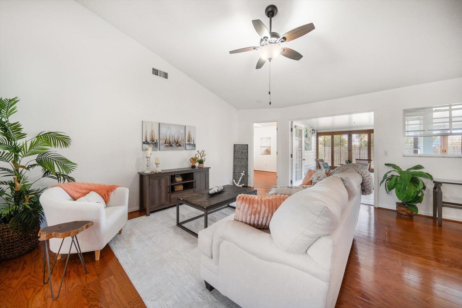 Spacious living area with vaulted ceilings.