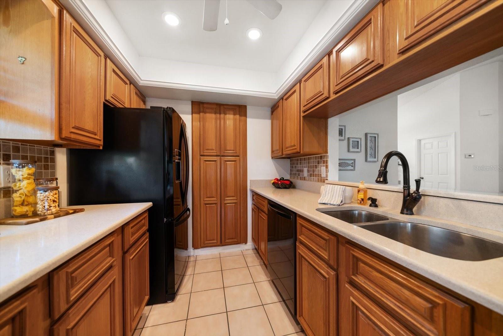 Kitchen sink over looks the living room.