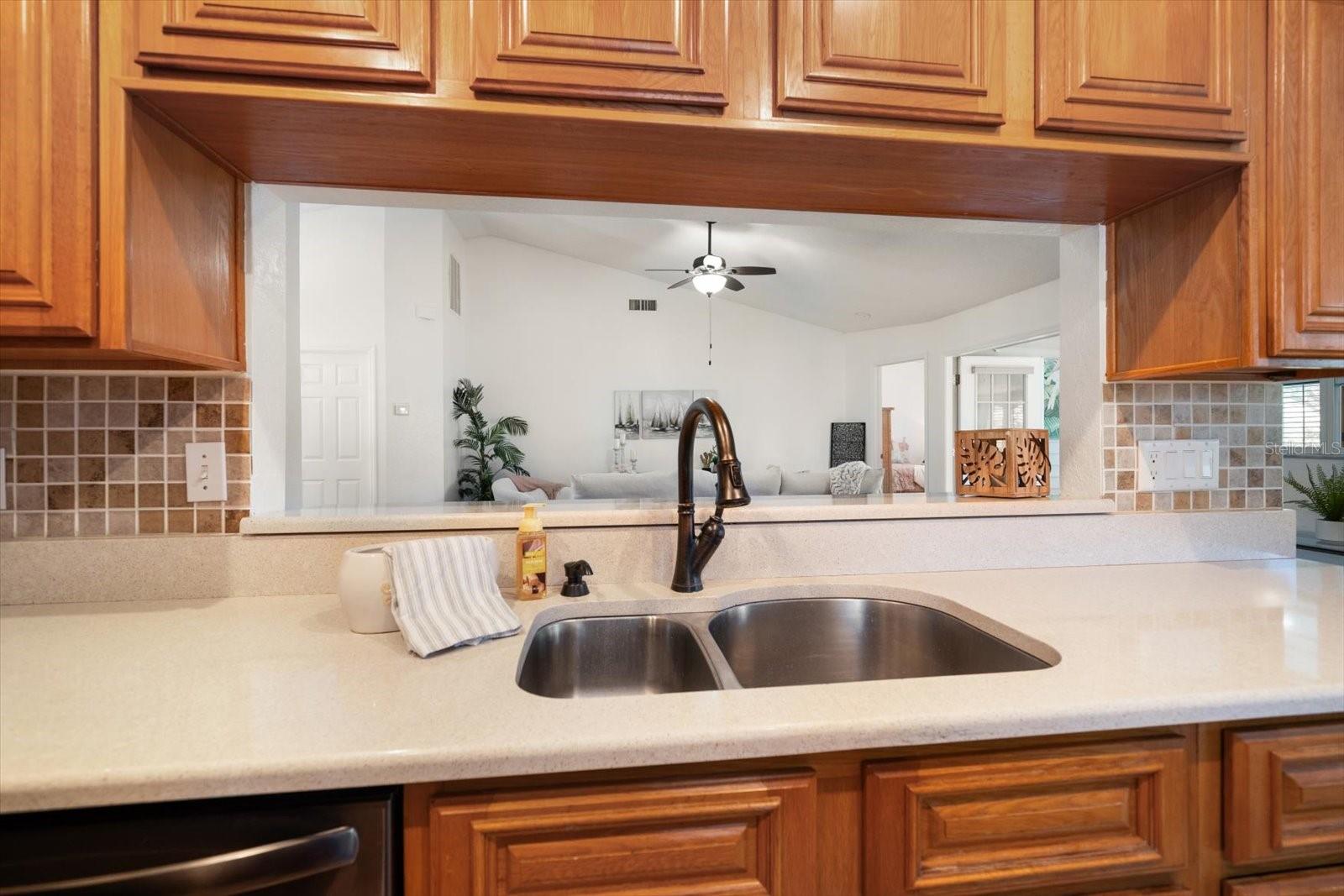 Kitchen with garden window and pantry area.