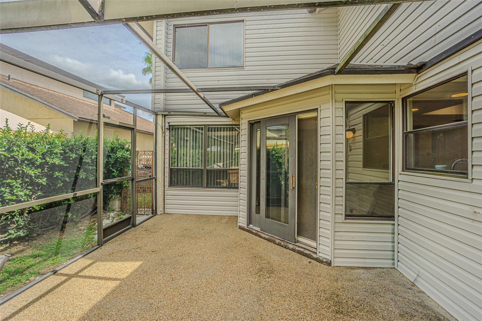 Exit from Kitchen to screened in pool deck