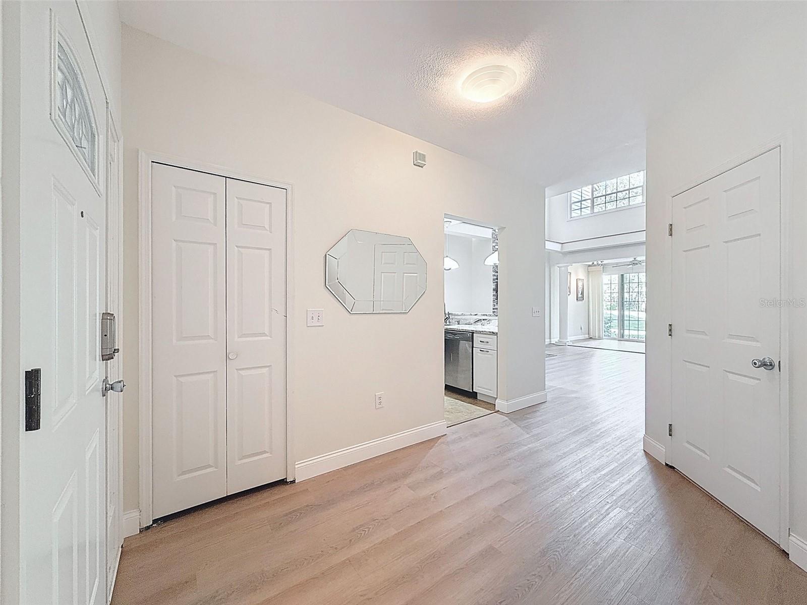 Foyer and view of the kitchen and living room