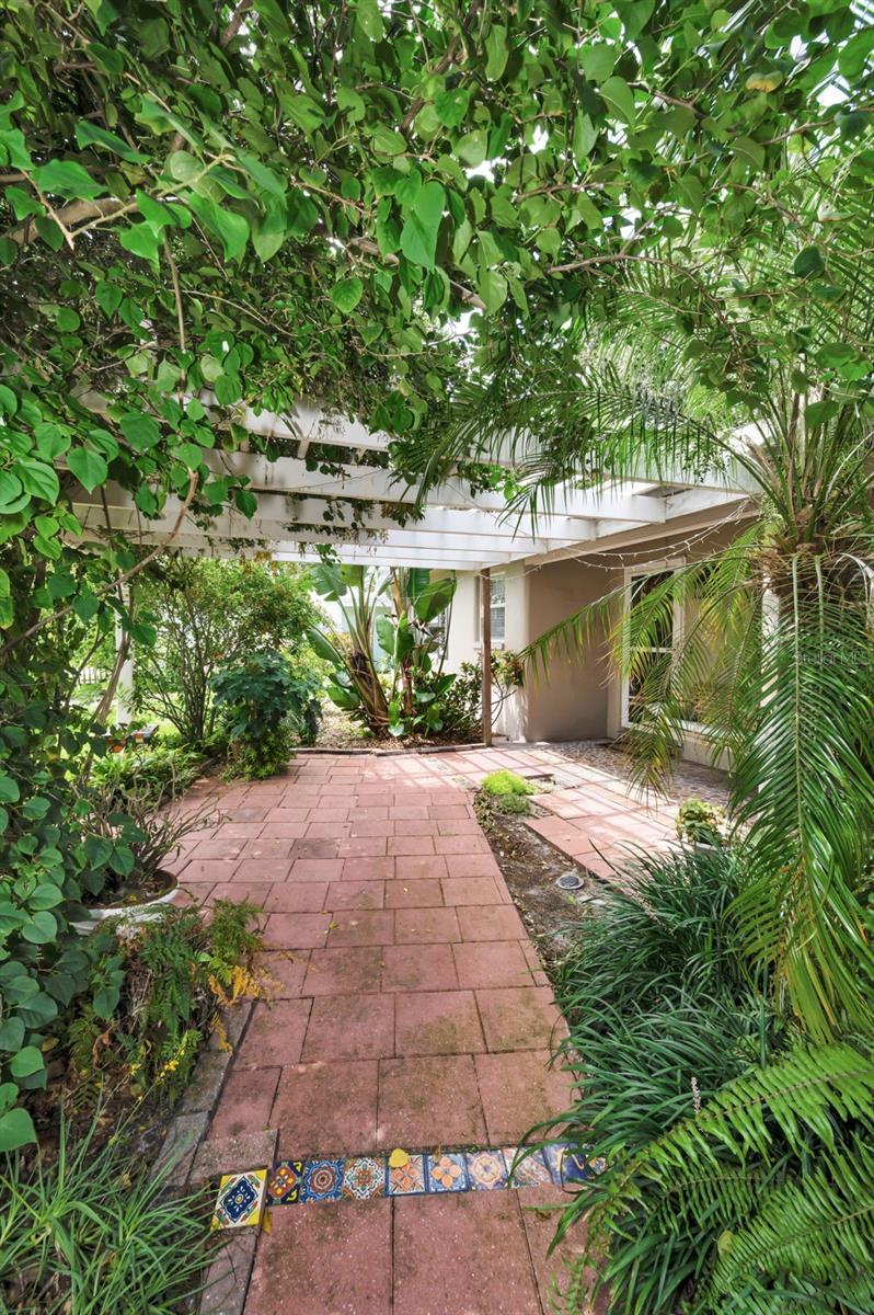 front walkway with attached pergola to front porch
