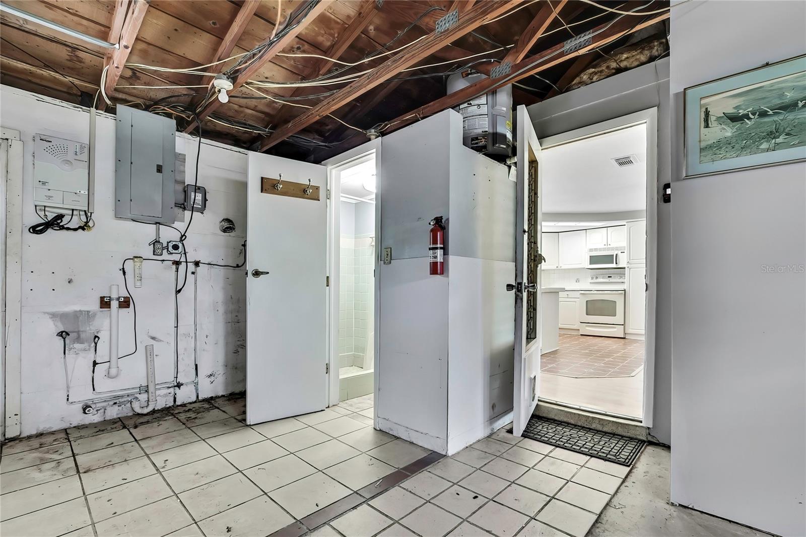 view of half bath and entrance into kitchen