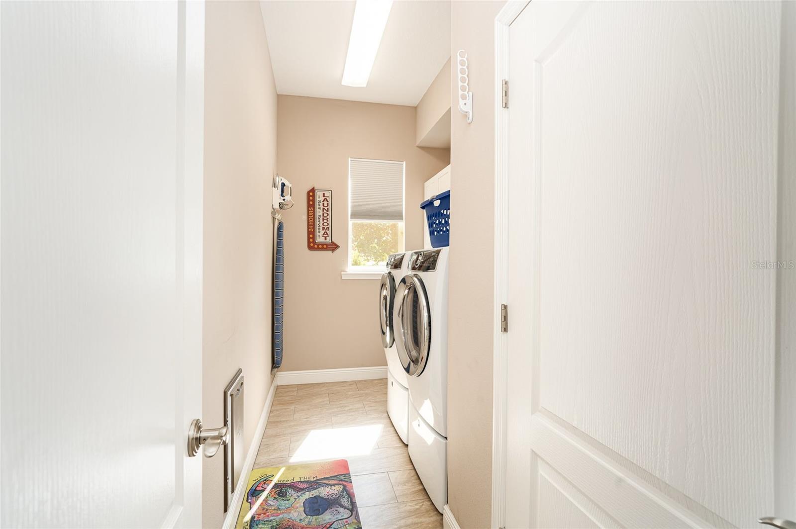 Laundry room with built in cabinets