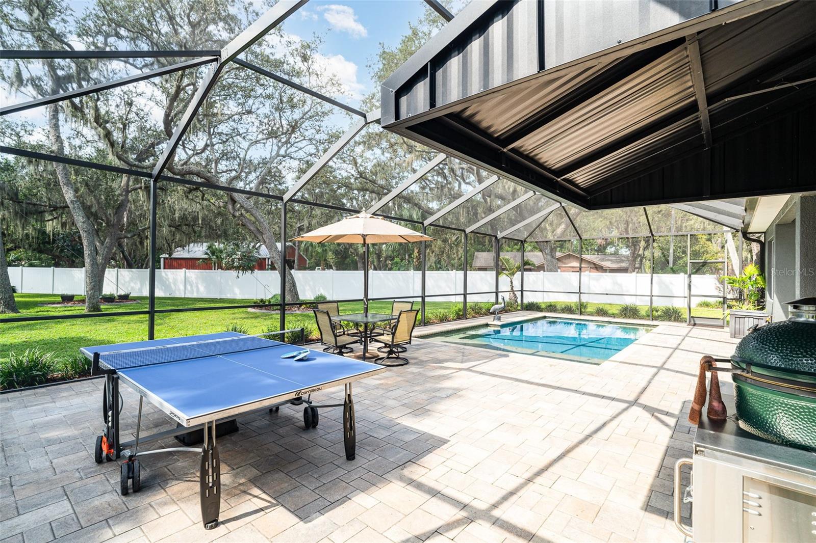 Brick paver decking and surrounding pool