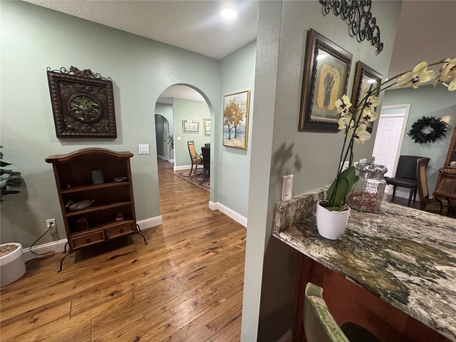 From family room, looking back into dining room & kitchen