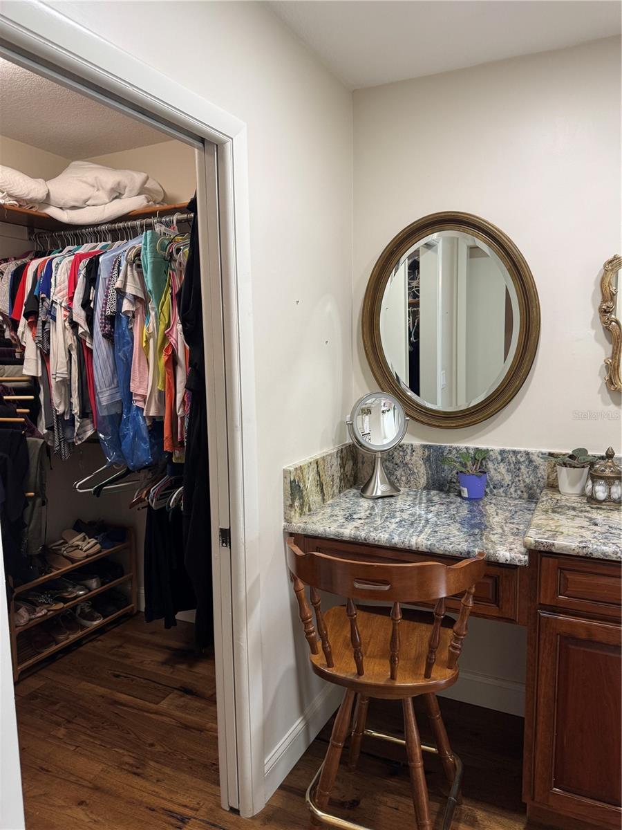 Master walk in closet (additional closet behind mirror sliding doors in master bedroom