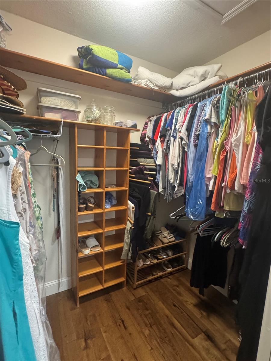 Master walk in closet (additional closet behind mirror sliding doors in master bedroom