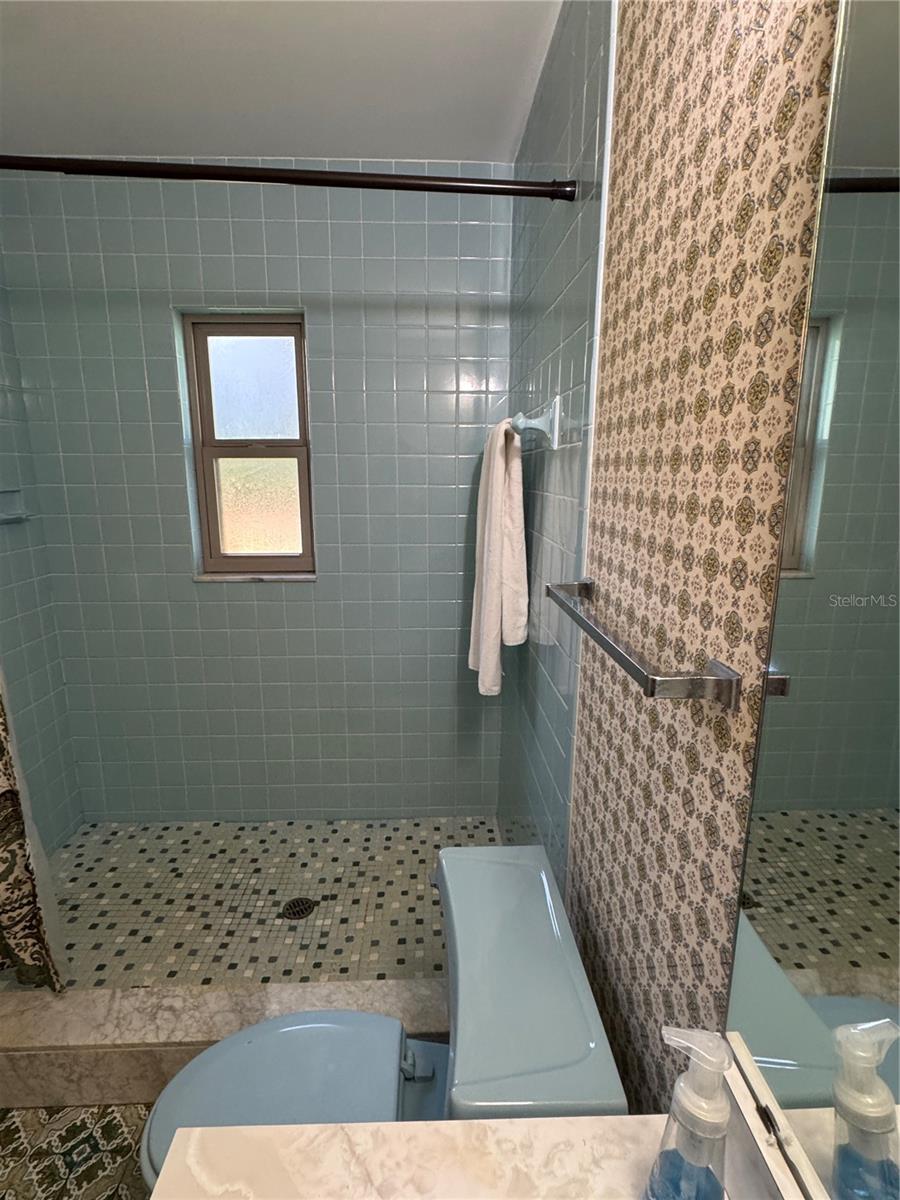 3rd full bath in garage & under ac 1973 orig.