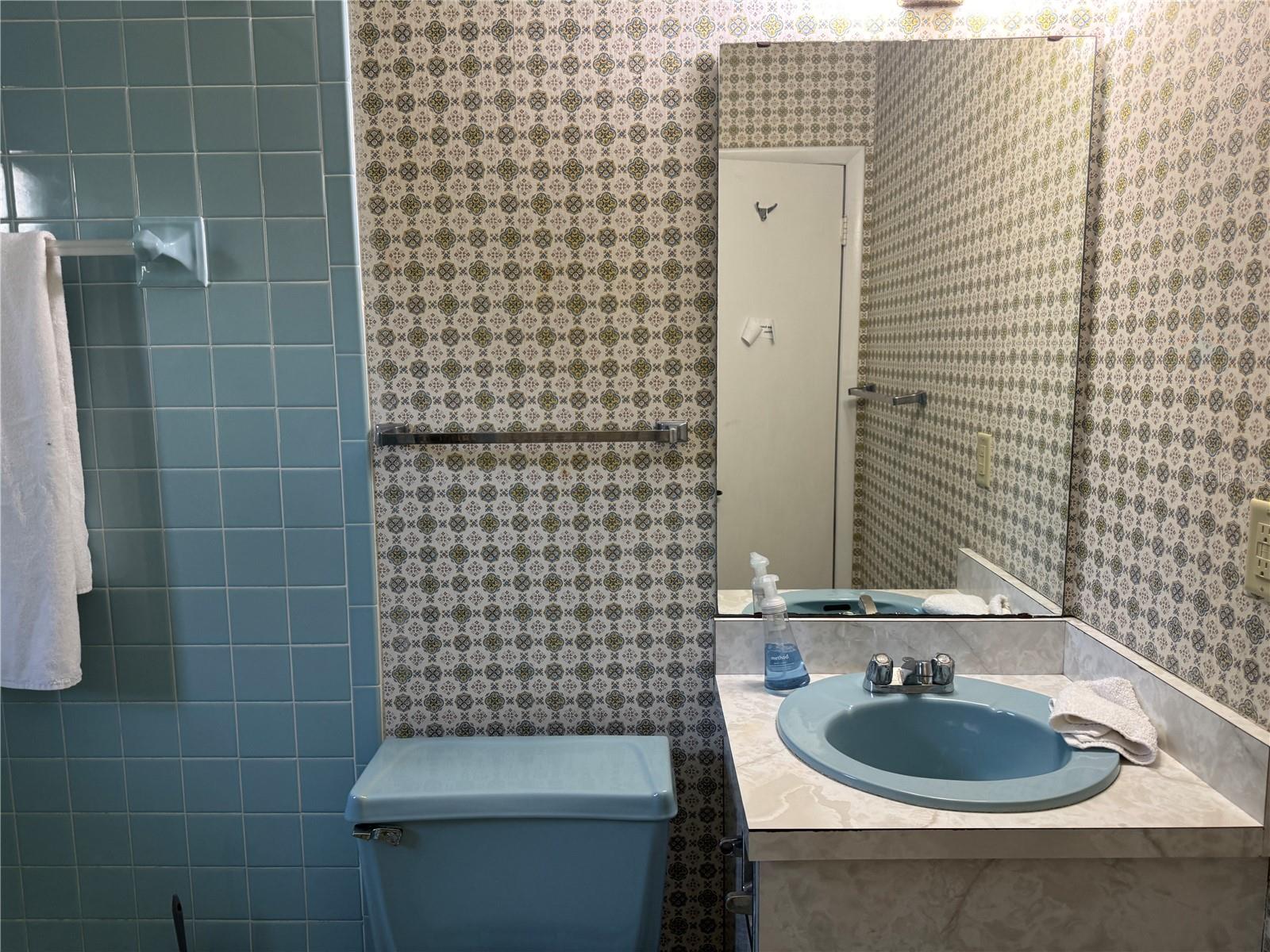 3rd bath, is in the garage & ac. Garage could easily be converted to additional bedroom - See County Zoning/Codes.  1973 orig.