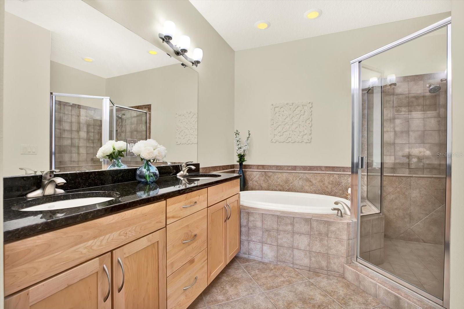 Primary En Suite, dual sinks, granite counters, separate soaking tub, shower and water closet.