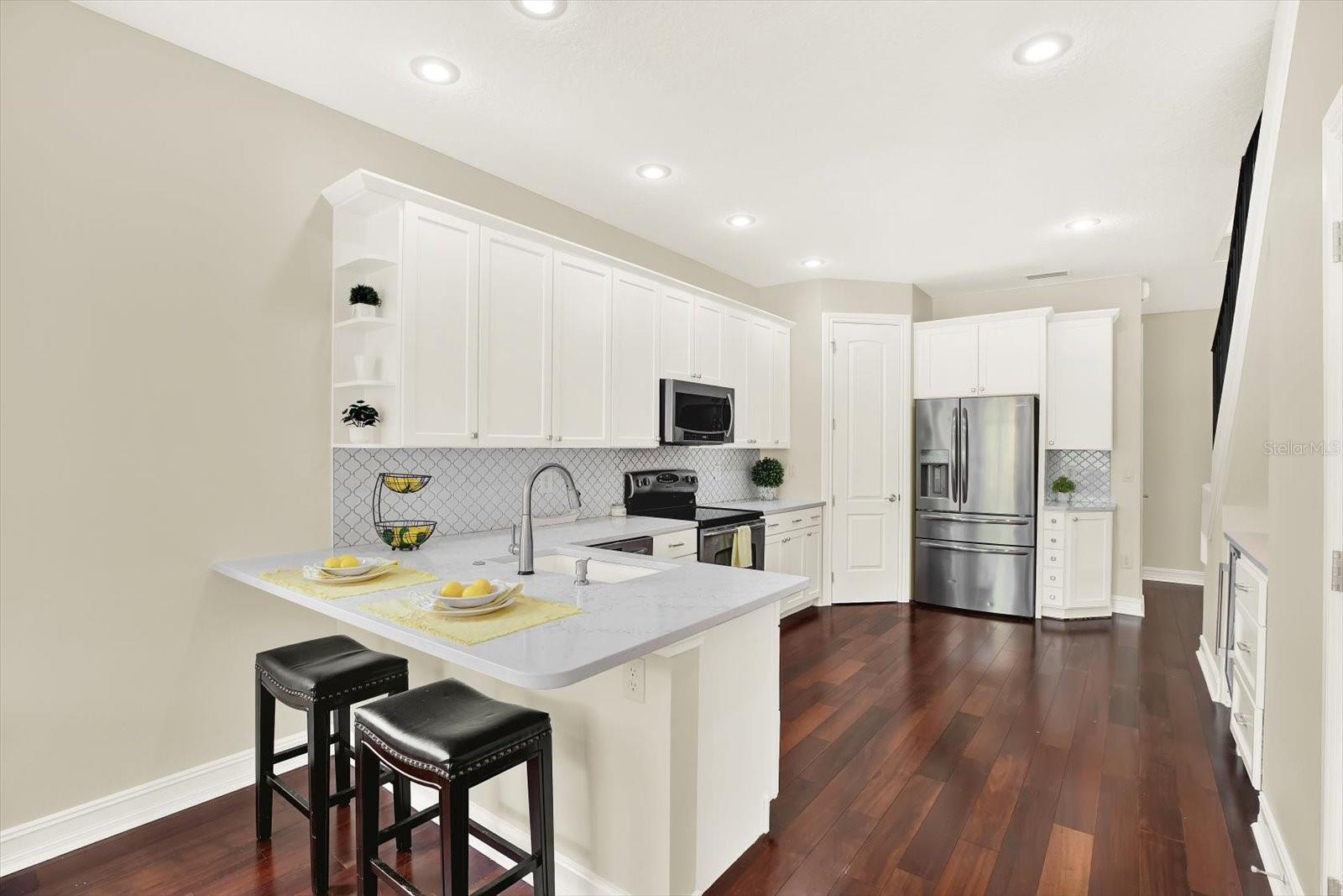 Updated kitchen with bar seating.