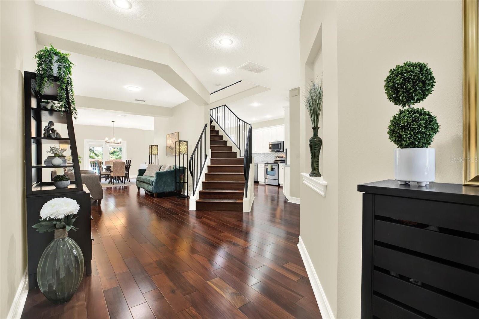 Front Foyer, high ceilings, entire interior freshly painted!  Wood floors.