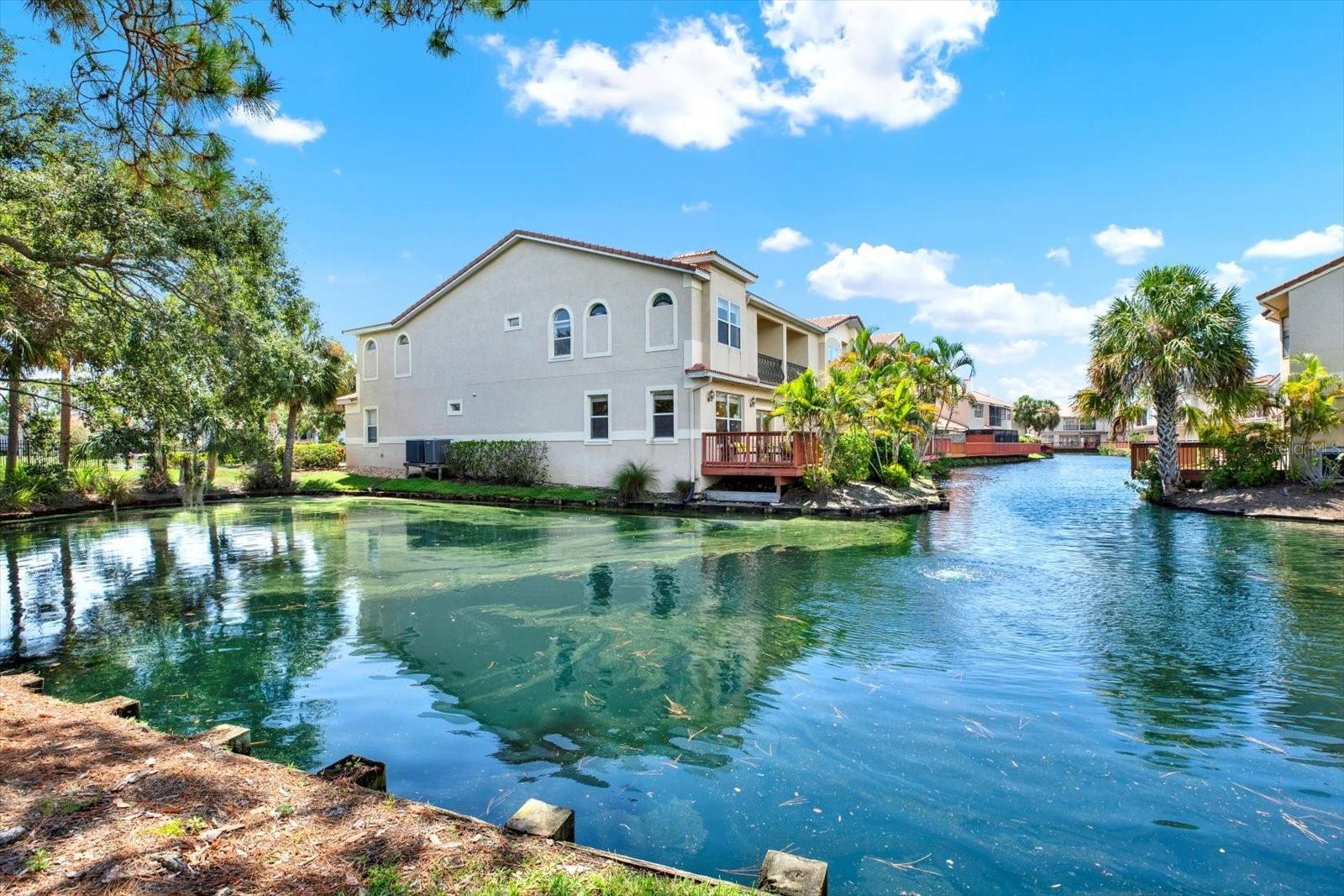 Private end unit with large open patio situated with Pond view.