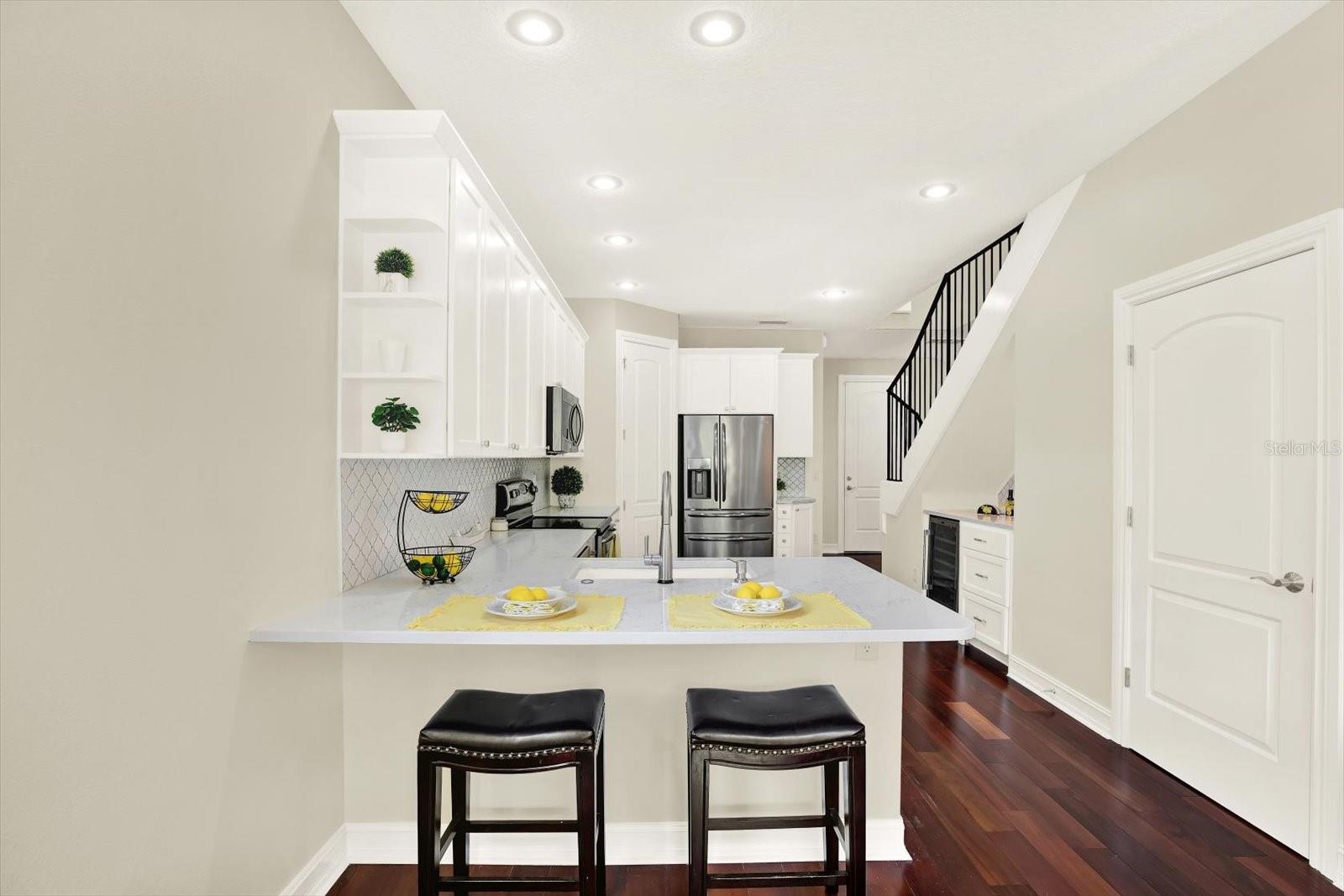 Updated kitchen, quartz counters, shaker style cabinets, wine fridge