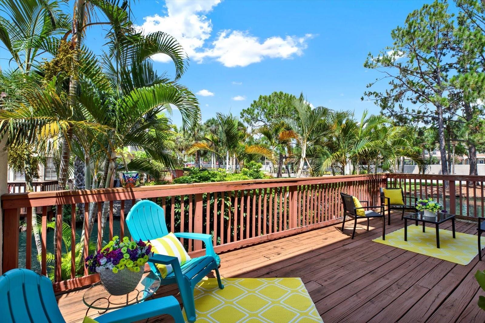 Beautiful patio/deck with tranquil water / pond view.