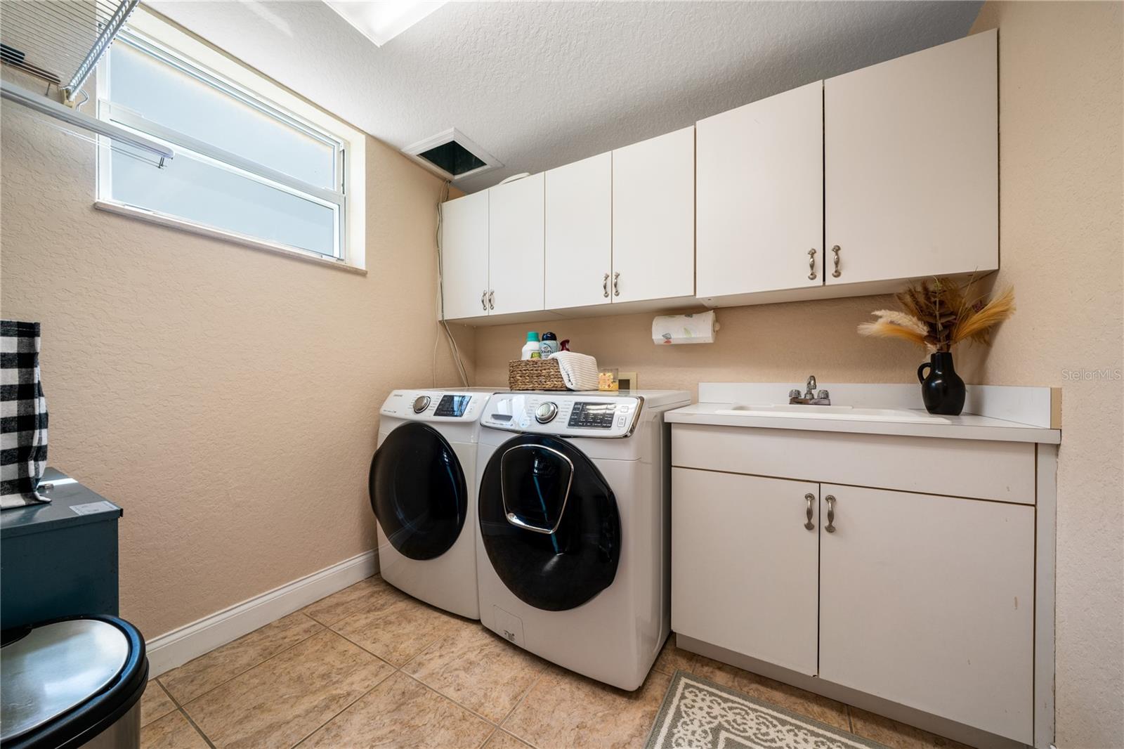 laundry room with laundry shoot from third floor