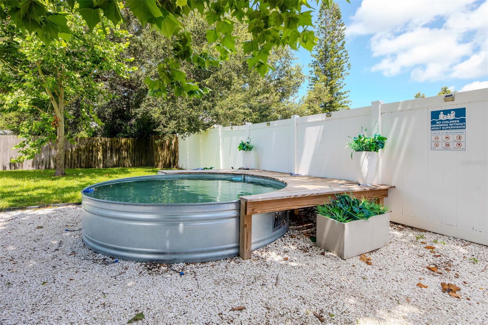 2 ft deep by 10 ft stock tank pool with deck