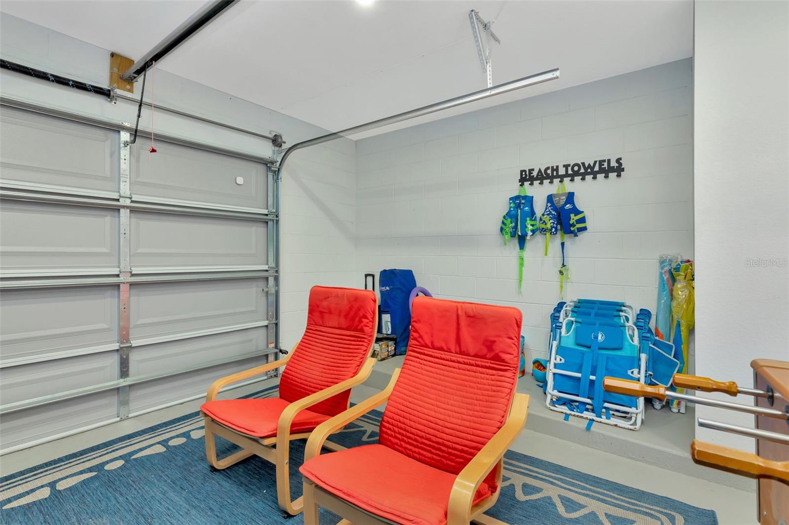 Beach supply storage area in garage.