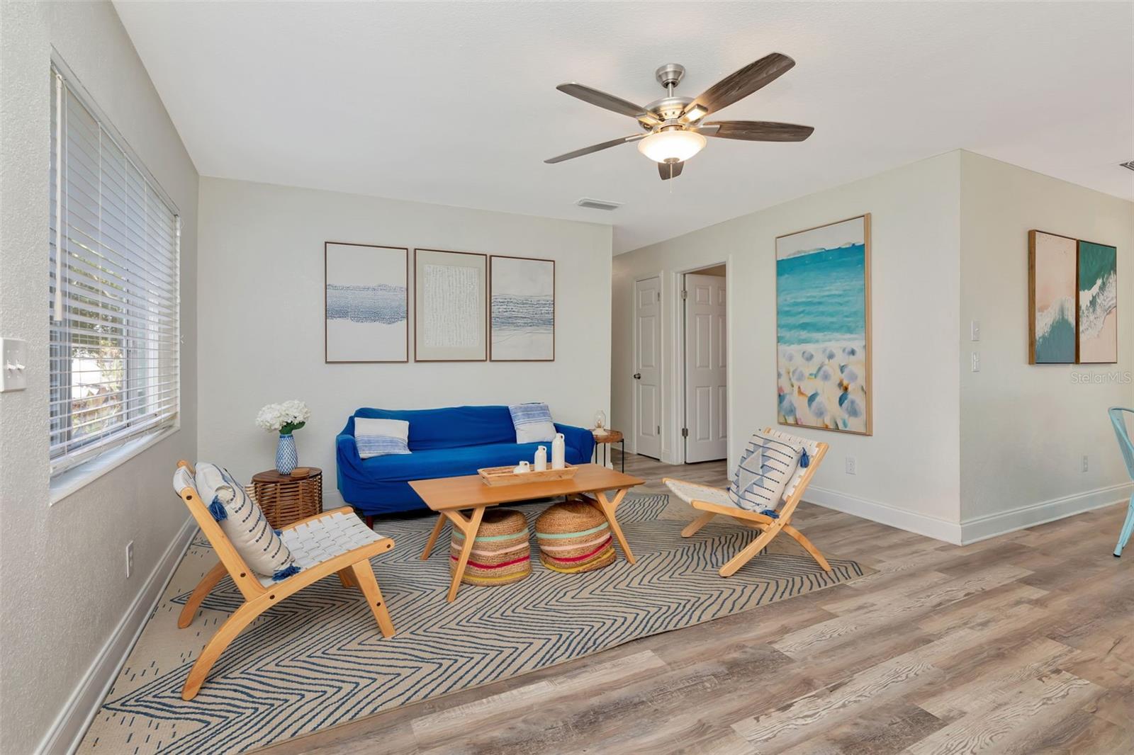 Main living area and entrance to dining room and kitchen