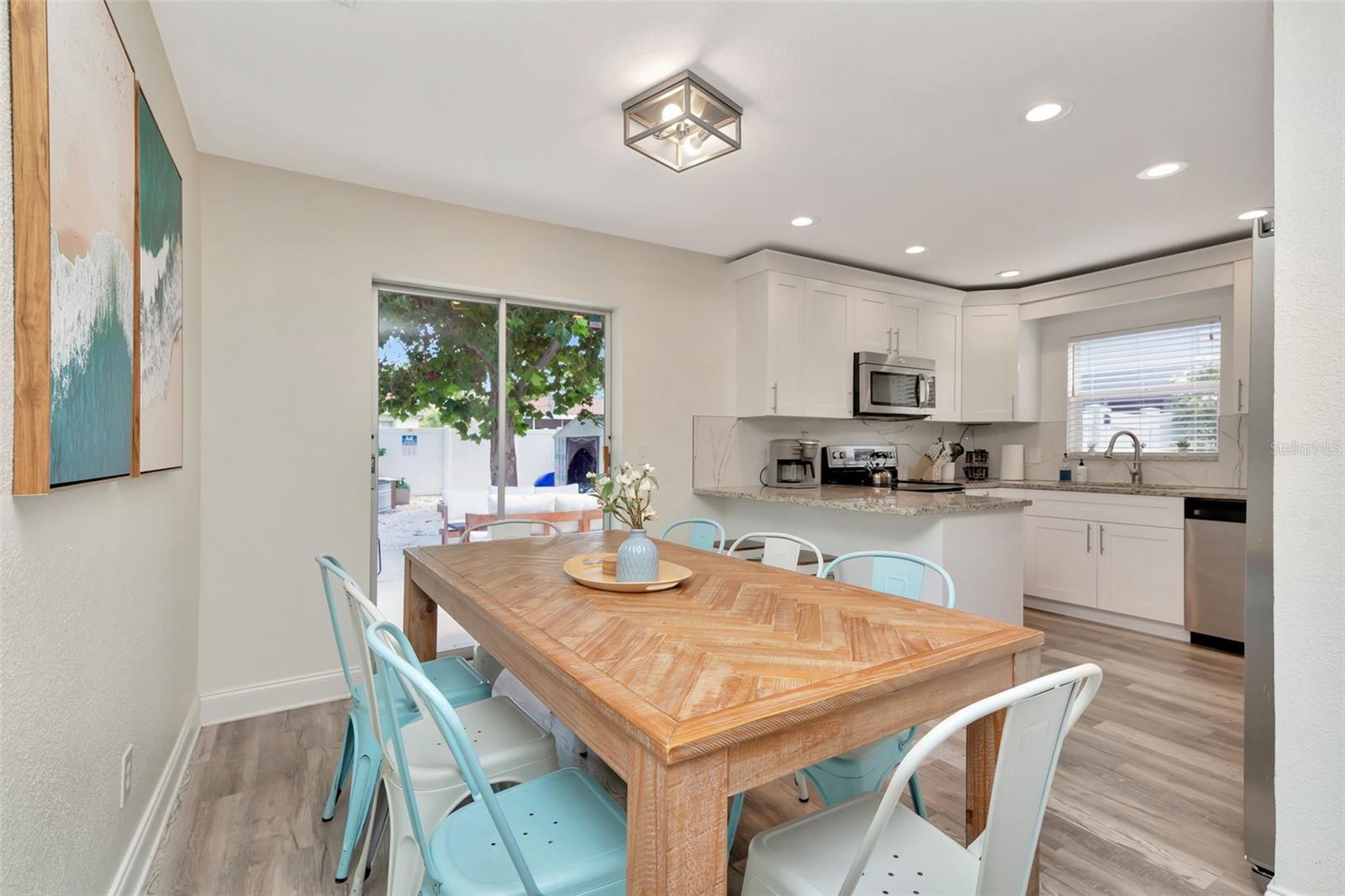 Sliding doors to backyard oasis, dining area and kitchen.