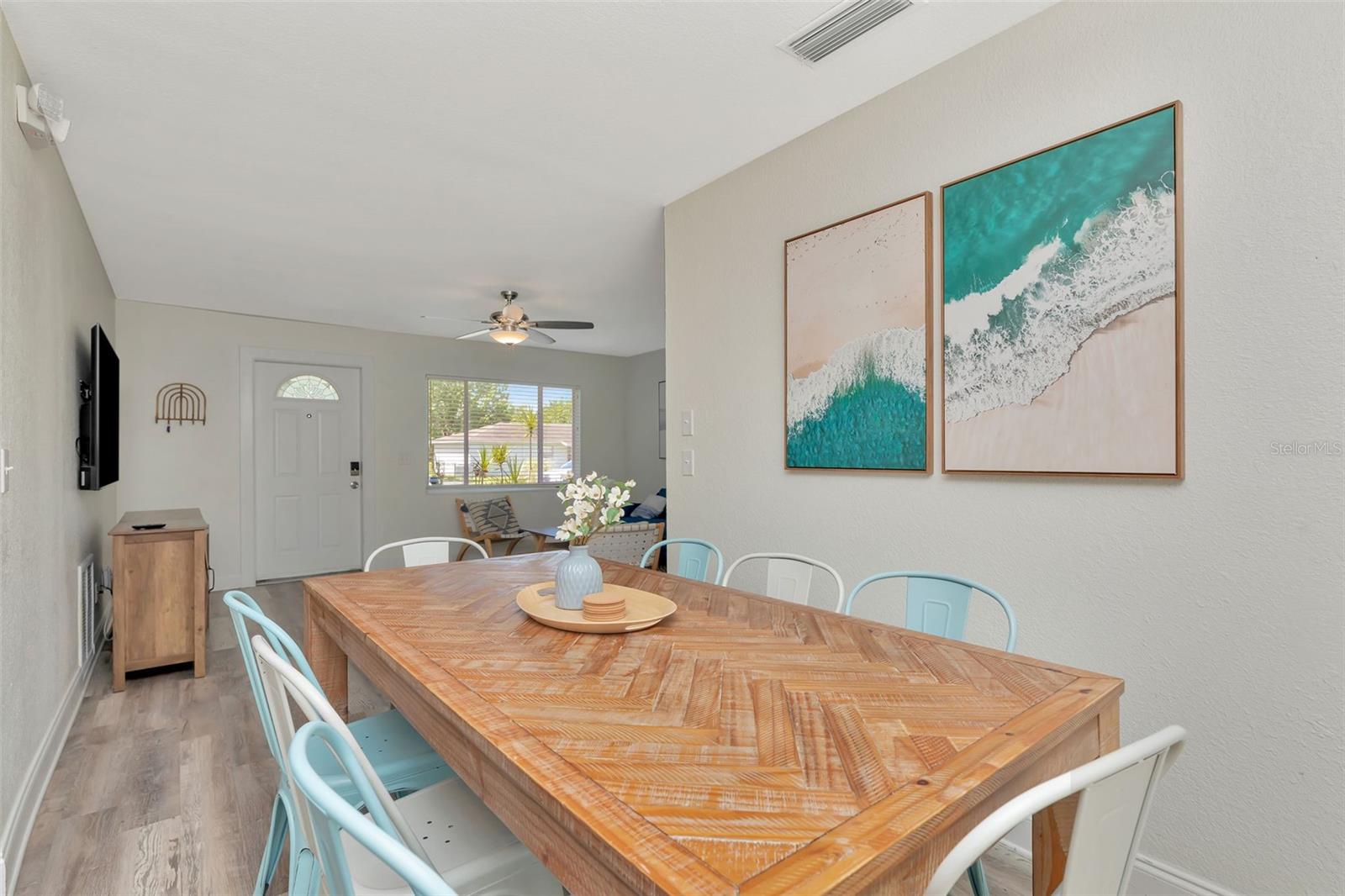 Another view into the living room from the dining room.  Door is the front door to the home.