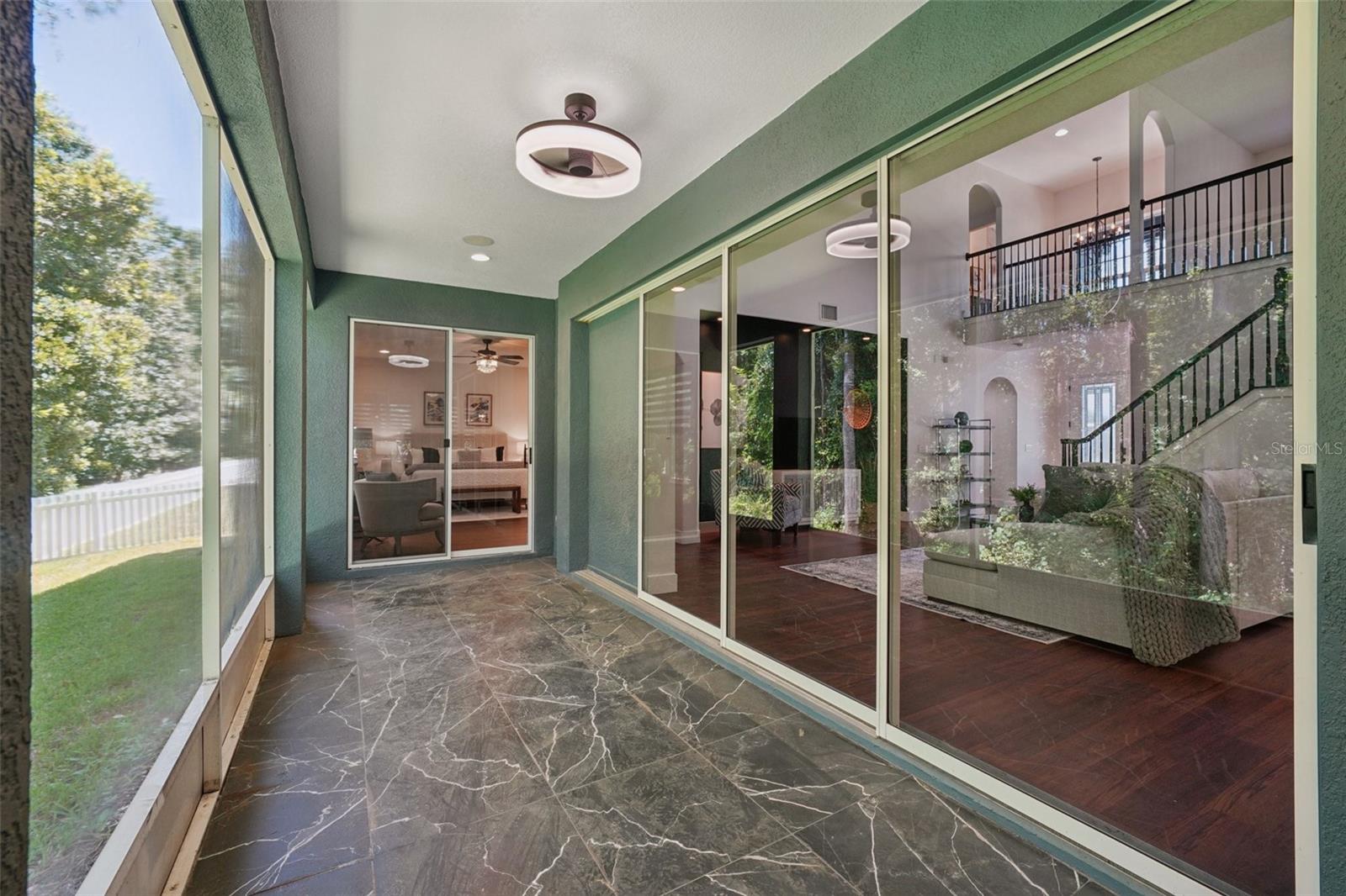 Lanai with access from Primary Suite, Family Room, and Kitchen Dinette Area