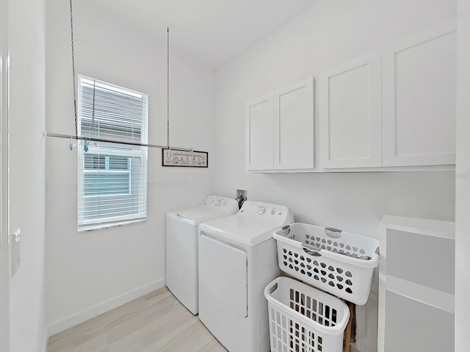 Laundry Room with lots of storage.  Washer and Dryer do not convey.