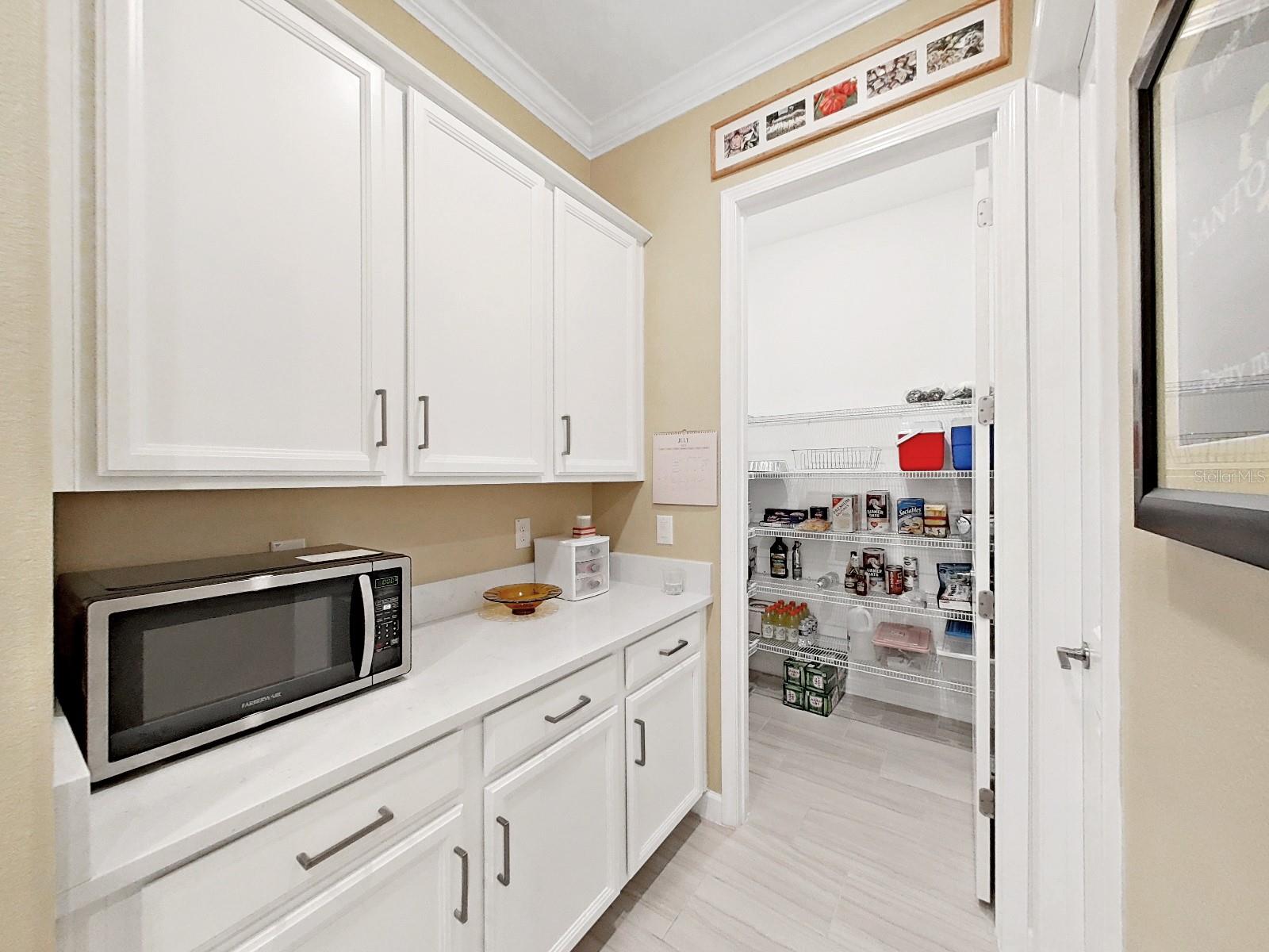 Off Kitchen Storage, Pantry and Laundry Room.