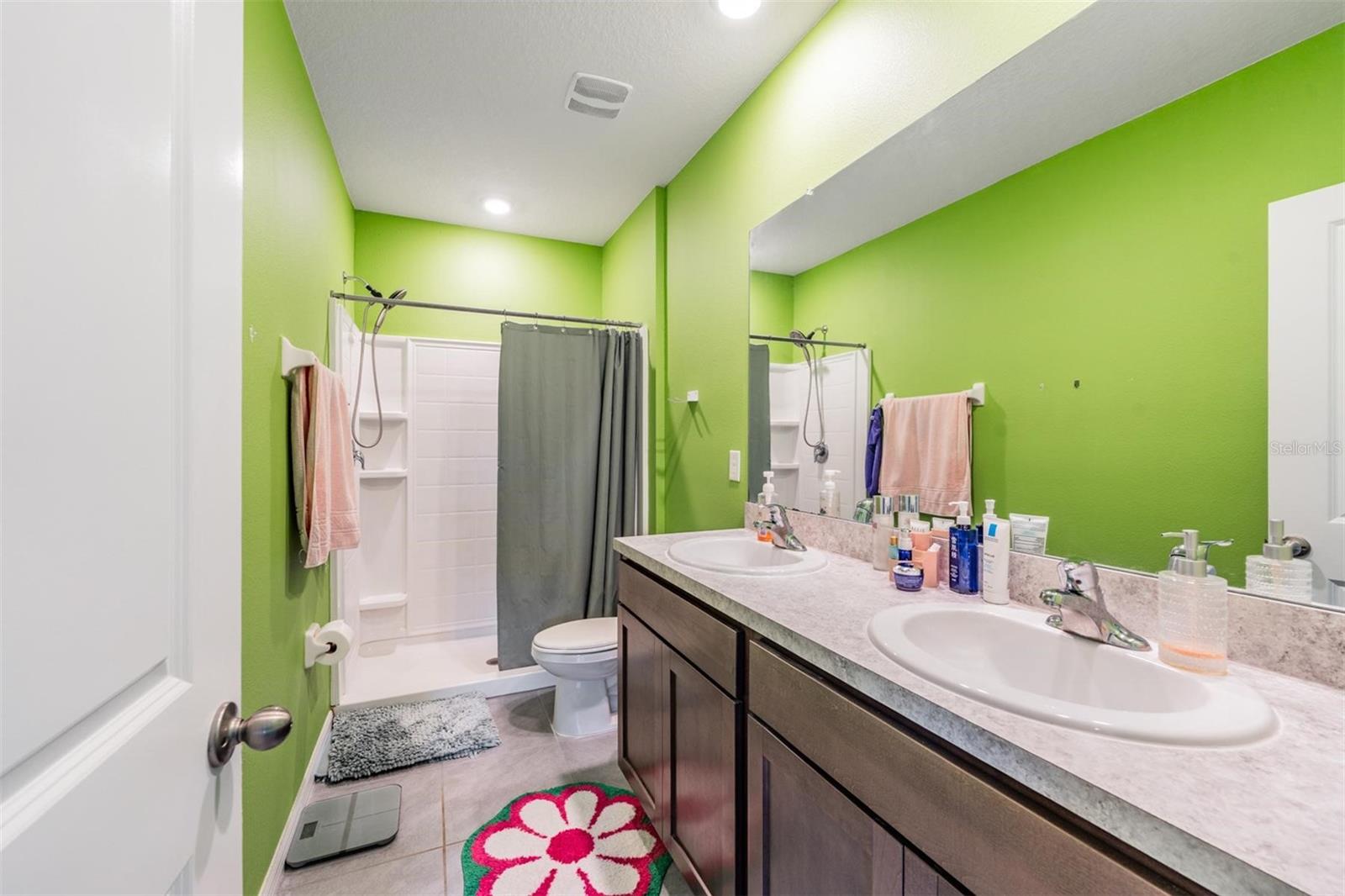 Primary ensuite full bath with walk in shower