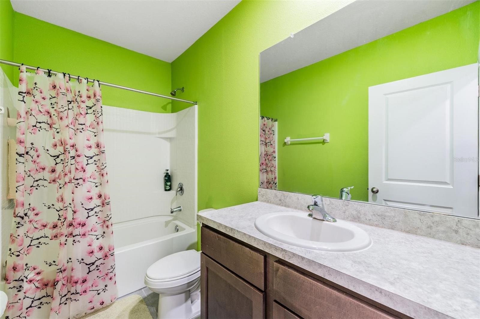 Guest bath with tub and tile enclosure